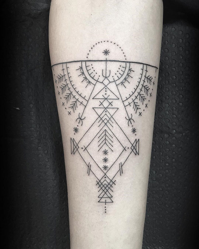 Geometric tattoo design by famous artist, featuring intricate lines and patterns on an arm. Geometric tattoo design by famous artist, featuring intricate lines and patterns on an arm.