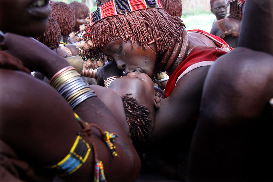 A Woman Kisses Her Child During A Tribal Ceremony Held By The Hamer In The Omo Valley, Ethiopia