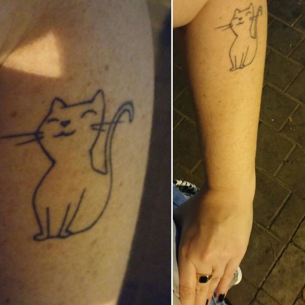 Minimalist cat tattoo on a forearm, featuring a simple and elegant line design to express cat person identity.