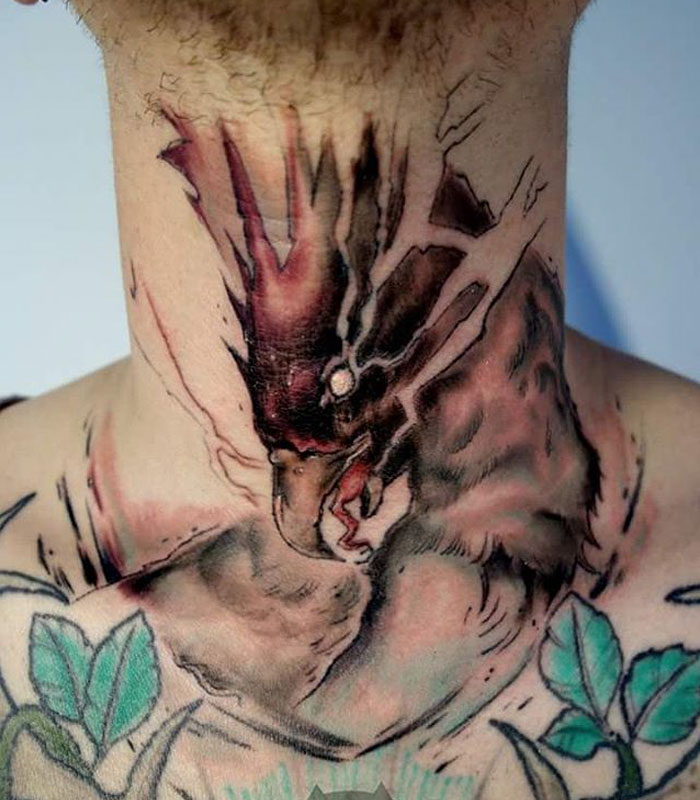 Unique small bird tattoo design on neck with vibrant colors and intricate details.