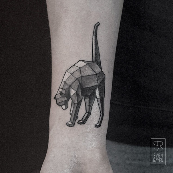 Geometric cat tattoo on forearm showcasing creative cat person design.