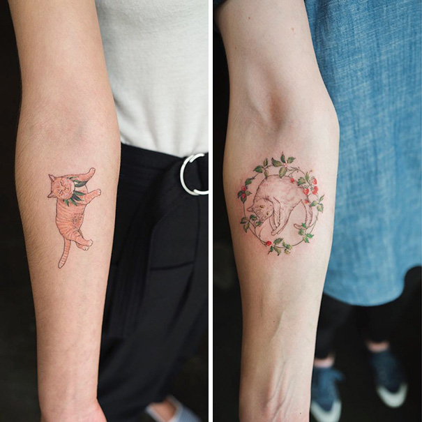 Two forearm cat tattoos, one with a playful cat, the other a sleeping cat surrounded by flowers, showcasing cat tattoo ideas.