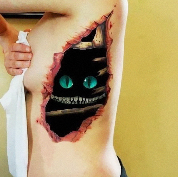 Cat tattoo with glowing eyes and a wide grin, creating a striking visual on a person's side.