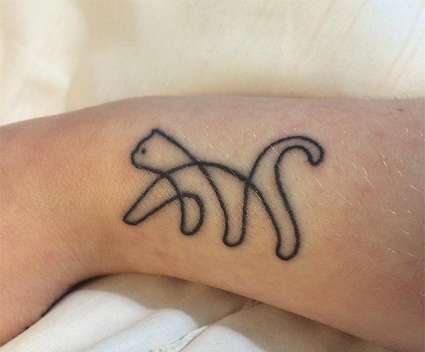 Simple cat tattoo design on forearm, showcasing minimalist style for cat lovers.