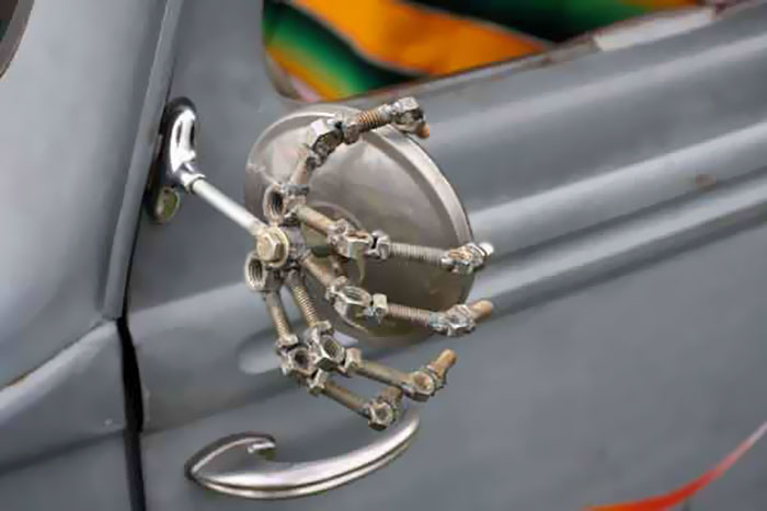 Bolted Skeletal Hand Holding The Wing Mirror