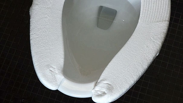 Use Your Unwanted Socks To Keep The Toilet Seat Warm