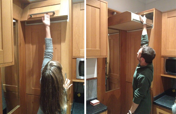 Picture of persons reaching drawers near the ceiling