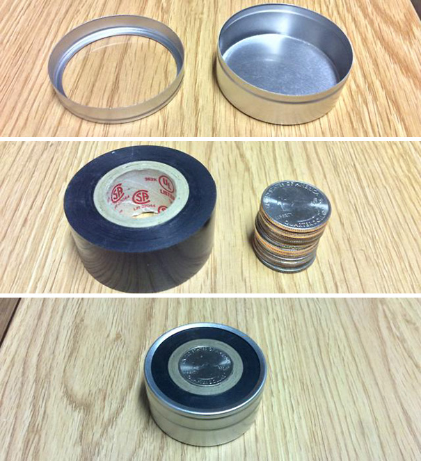 Satisfying perfect arrangement of a metal tin, tape roll, and coin stack on a wooden surface.