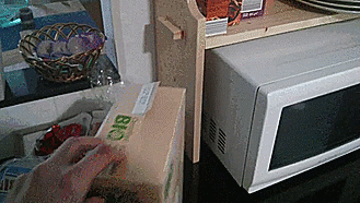 A box fits perfectly in a tight space between a cabinet and a microwave, satisfying perfectionist's soul.
