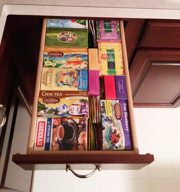 Perfectly organized tea drawer with neatly arranged colorful boxes satisfying a perfectionist's soul.