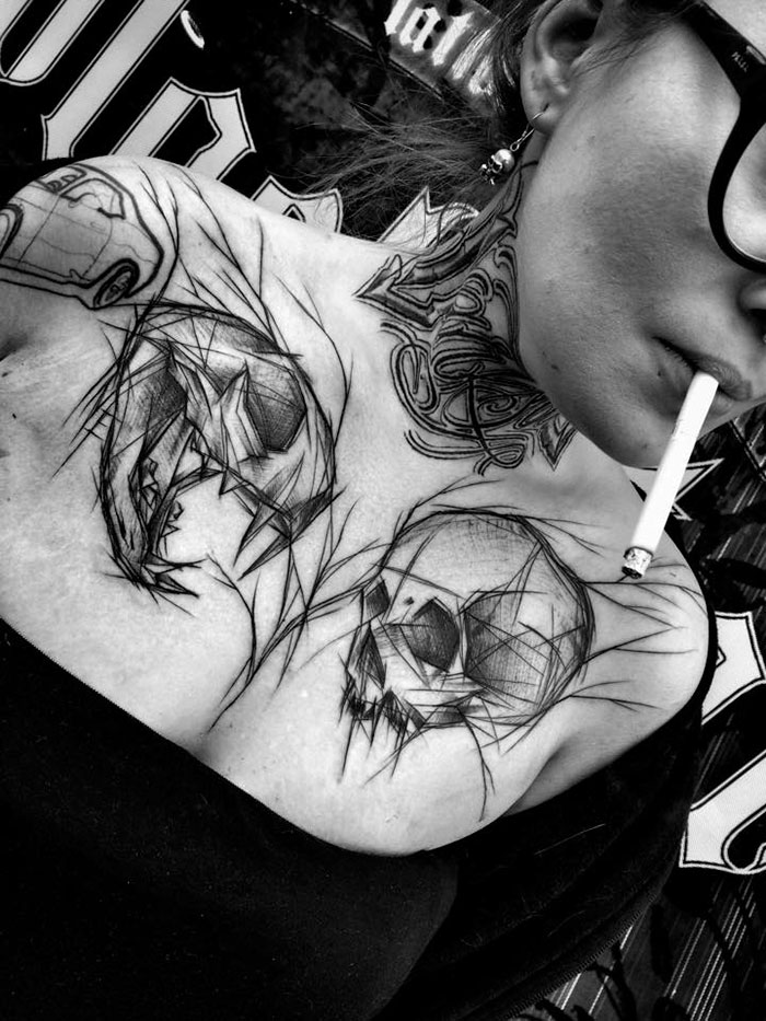 Woman with unique sketch tattoos on neck and shoulder, showcasing beauty of imperfection.