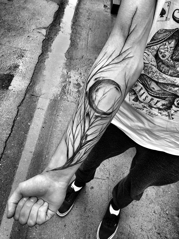 Sketch tattoo on a forearm by Polish tattoo artist, showcasing the beauty of imperfection in black ink.