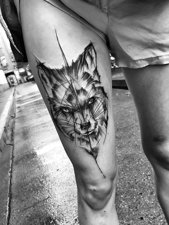 Sketch tattoo of a fox on thigh by Polish artist, showcasing beauty of imperfection.