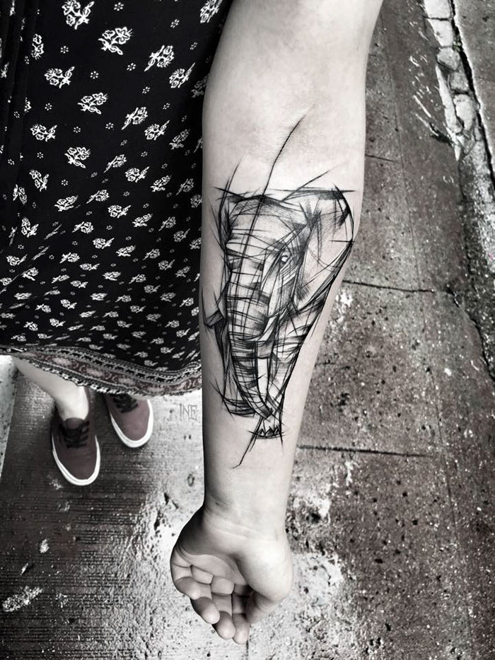Sketch tattoo of an elephant on a person's forearm by Polish tattoo artist, showcasing beauty of imperfection.