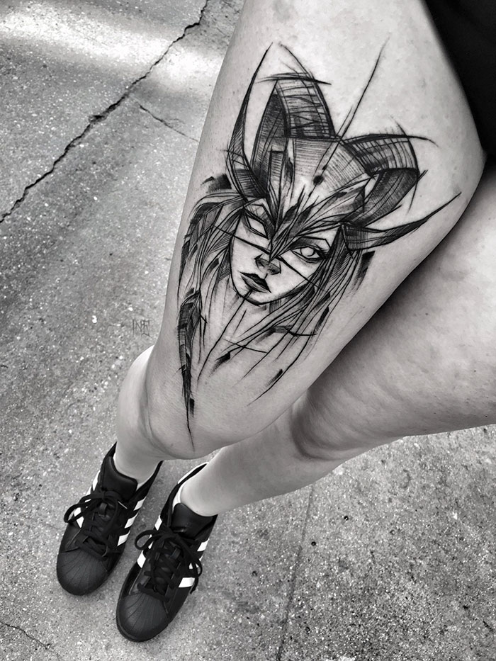 Sketch tattoo of a masked face on a person's thigh, showcasing the beauty of imperfection by Polish tattoo artist.