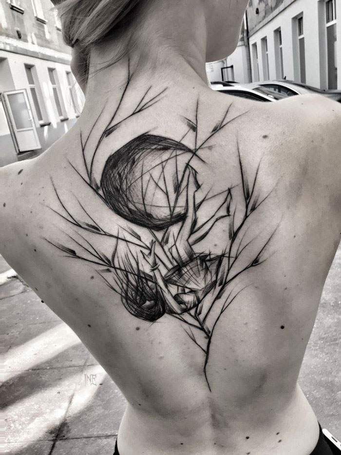 Back with a sketch style tattoo by Polish artist, showcasing beauty of imperfection in intricate design.