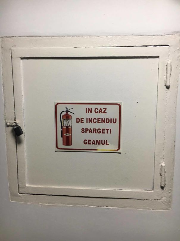 Translates To "break The Window In Case Of Fire". Clearly Not Any Window..