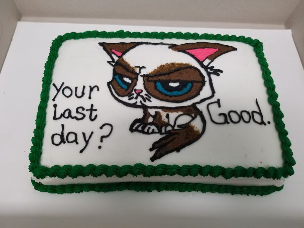 Farewell cake with grumpy cat illustration, reads "Your last day? Good." in green icing border.