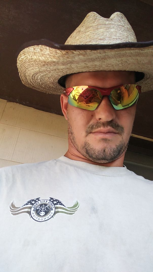 Man wearing reflective sunglasses and a wide-brimmed hat, showcasing changes seen in before and after stopping drinking.