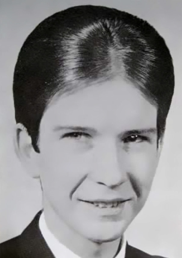Black and white photo of a young man with a classic 1960s hairstyle.