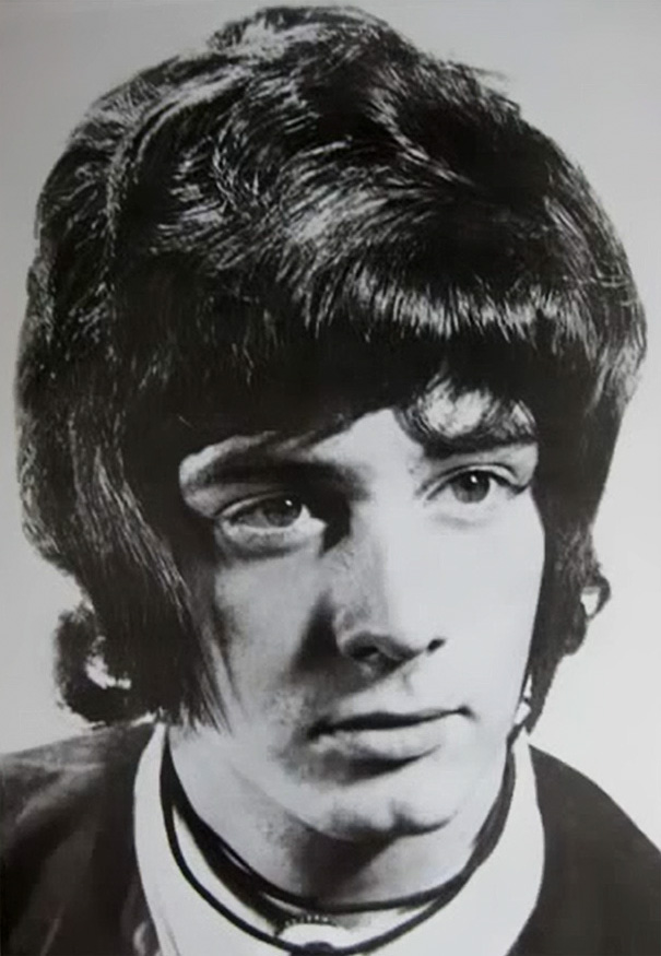 Vintage black and white portrait showcasing romantic men's hairstyle from the 1960s.