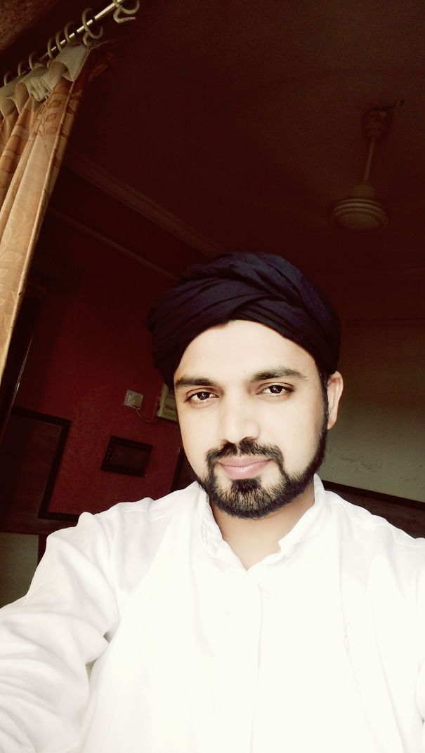 Man with beard and turban smiling indoors, illustrating positive changes in before-and-after pics of stopping drinking.