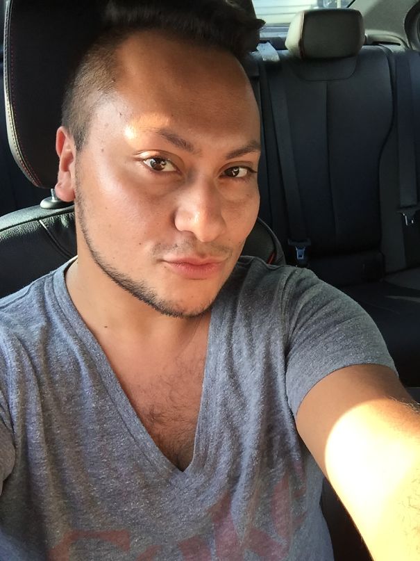 Man taking a selfie in a car showing glowing skin and healthy appearance after stopping drinking.