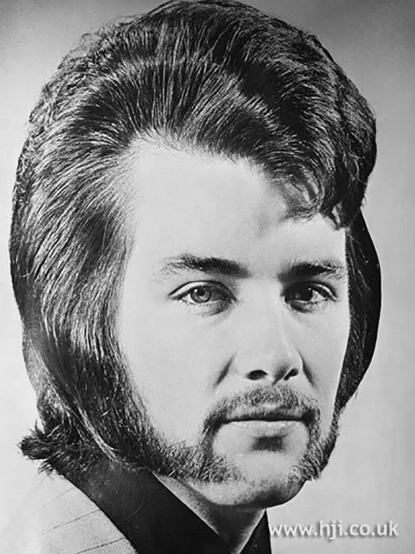 1960s men's hairstyle with sideburns, black and white portrait.