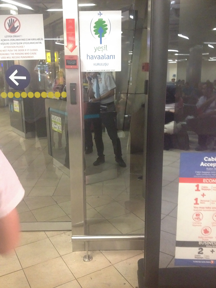 So I Realized My Leg's Reflection On The Separation Glass Fits Perfectly To The Airport Crew Guy