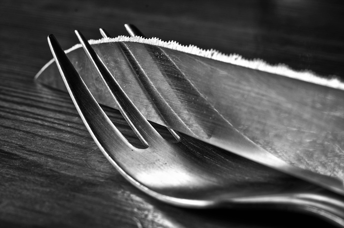 The Reflection On A Knife Completes The Fork