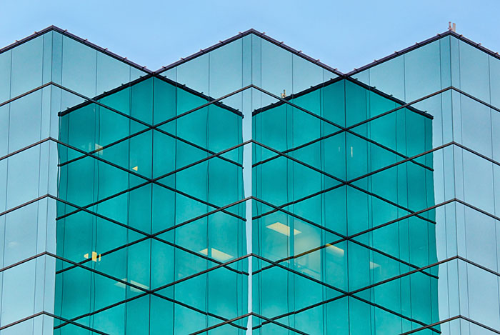 Looks Like There Are Three Buildings And One In The Middle Is Transparent