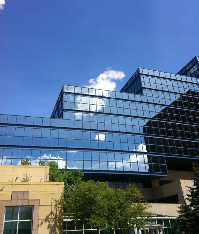 Perfectly Aligned Cloud And Cloud Reflection
