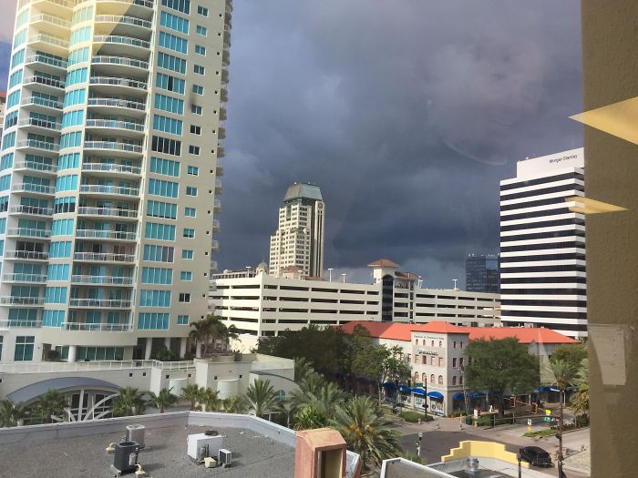 Co-worker Took A Picture Of Storm Clouds, But His Reflection In The Window Made Him Look Like The God Of Thunder