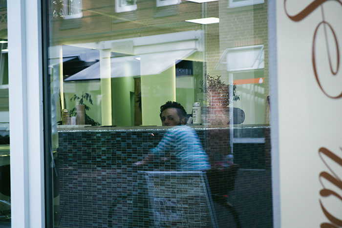 Window Reflection And Perfect Timing Combined A Cyclist And A Man Into One