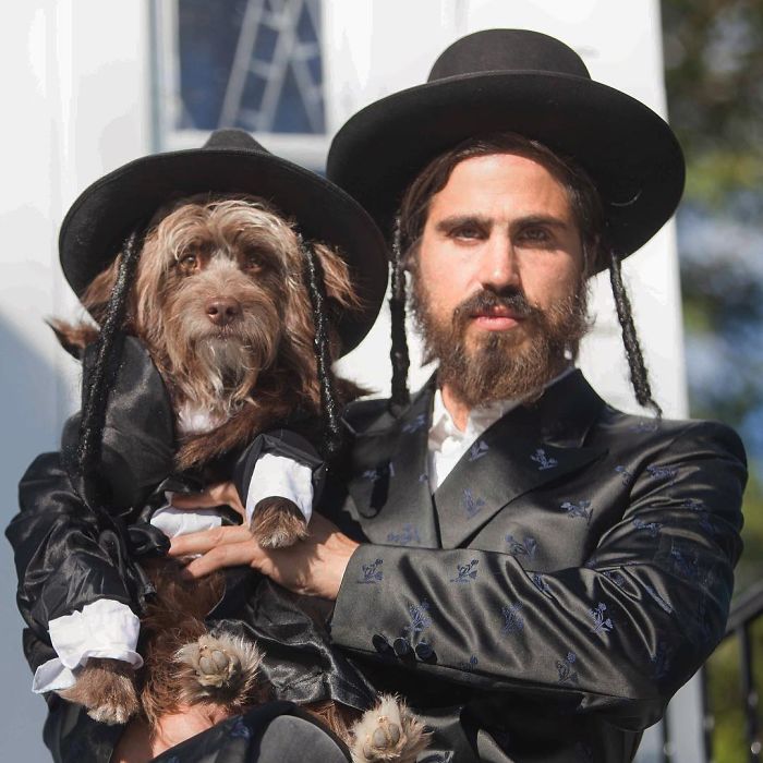 Dog And Human Dressed In Matching Outfits