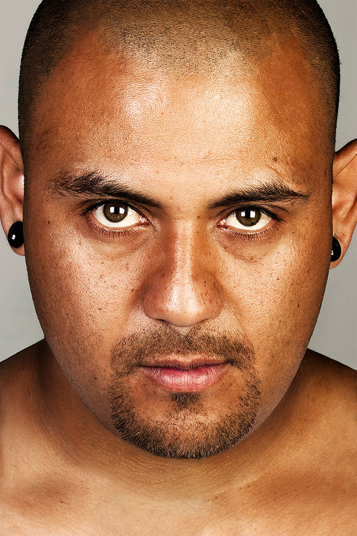 Ex-gang member with tattoos removed, photographed up close, showing a transformed appearance. Ex-gang member with tattoos removed, photographed up close, showing a transformed appearance.