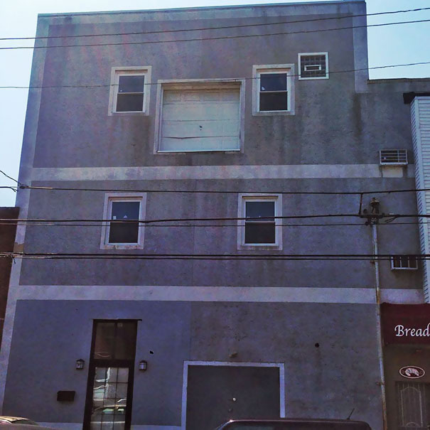 Went To Philly. Found A Building With A Garage Door On The Third Floor That Looks Like It's Been Hit By A Car