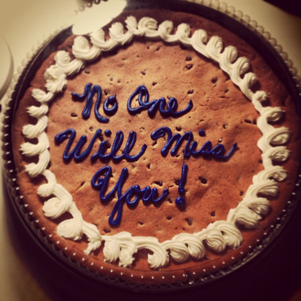 Farewell cake humorously decorated with "No One Will Miss You" message in blue icing.