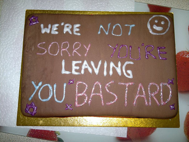 Farewell cake with humorous message in colorful icing for an office goodbye party.