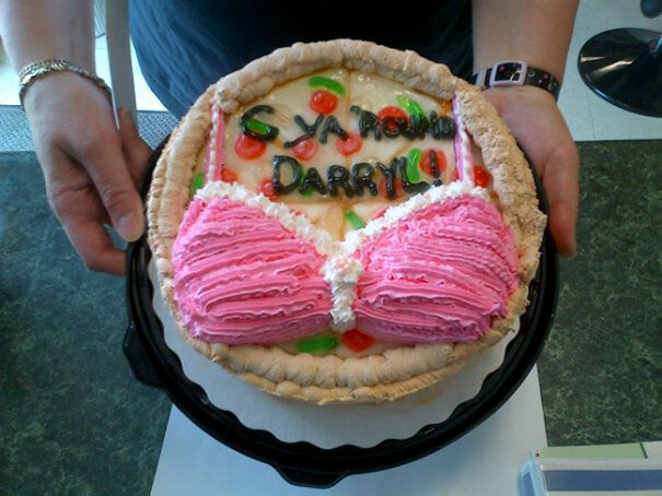 Farewell cake with humorous pink bikini design and a goodbye message for Darryl.