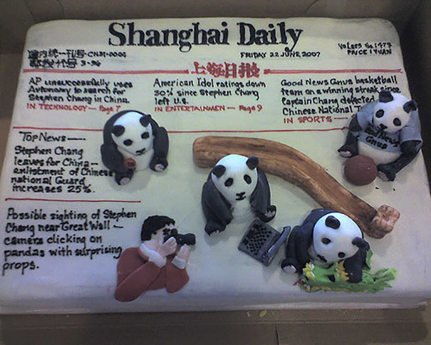 Farewell cake designed as a newspaper with panda figures in playful scenes, celebrating an employee's last day at the office.