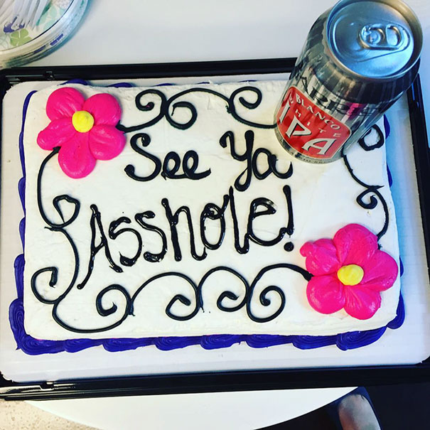 Farewell cake with humorous message and beer can, decorated with pink flowers.
