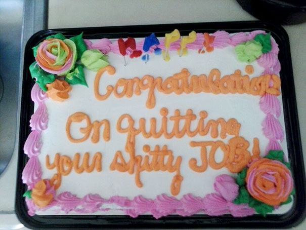 Farewell cake with colorful icing reads, "Congratulations on quitting your job," featuring floral decorations.
