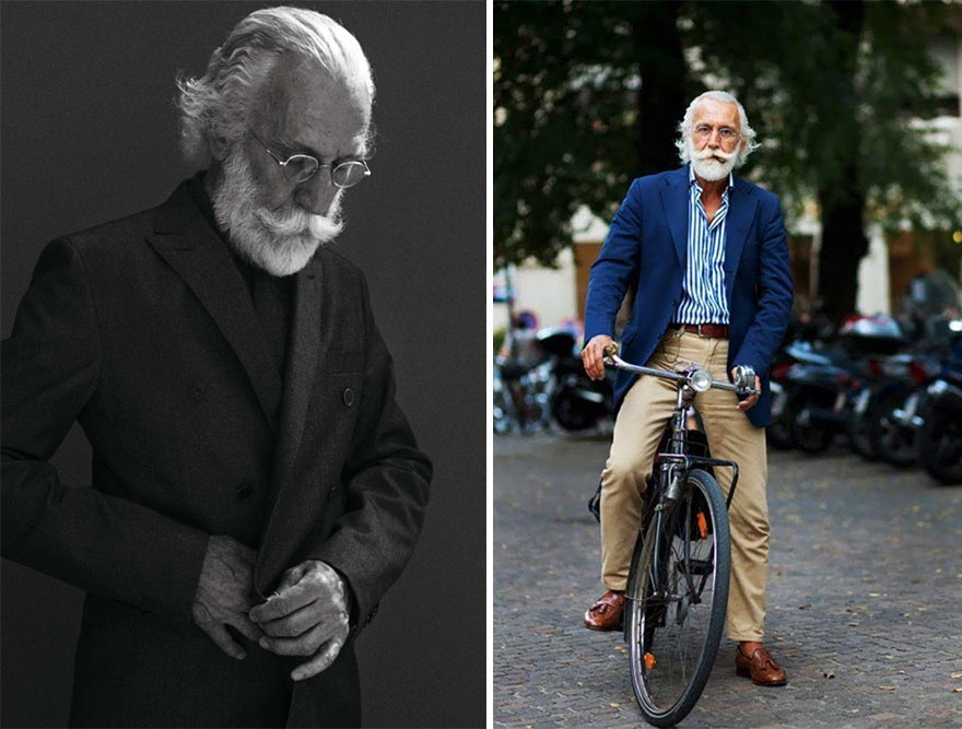 Stylish older man in a suit and glasses, posing elegantly and cycling in a blue blazer and striped shirt.