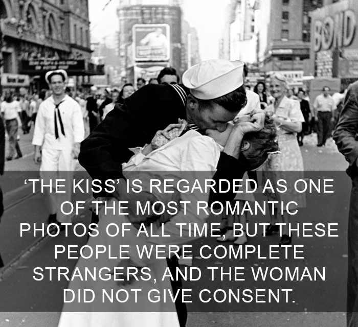 Black and white photo of a sailor kissing a woman in a crowded street, illustrating amazing facts about the world.