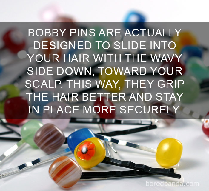 Colorful decorative bobby pins scattered on a white surface illustrating an amazing fact about hair styling tips.