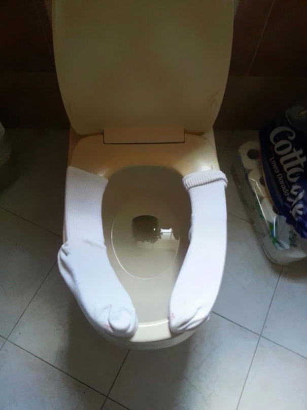 Use Old Socks To Keep The Toilet Seat Warm For Your Kids