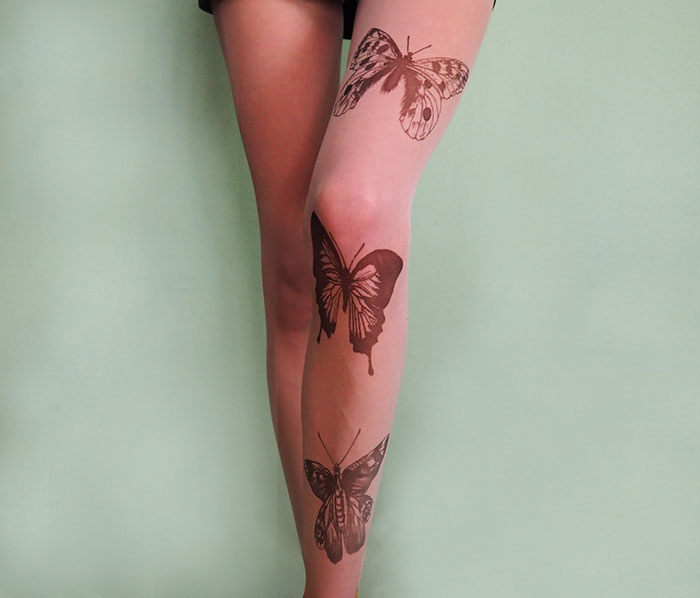 Butterfly design tattoo tights creating an illusion of inked legs.