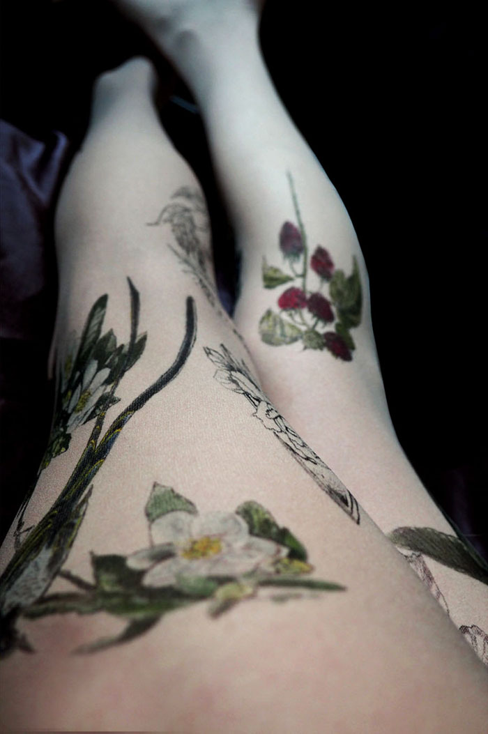 Tattoo tights with floral designs creating an illusion of inked legs.