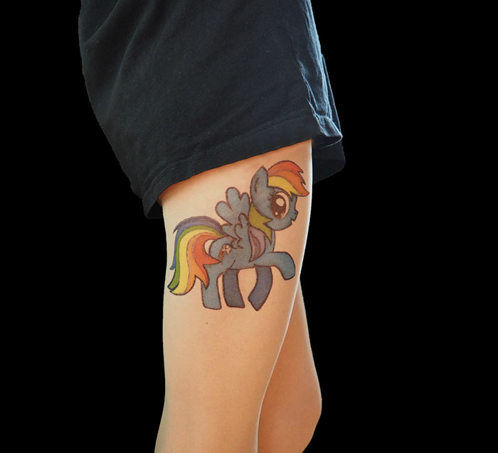 Tattoo tights featuring a colorful cartoon character, creating the illusion of inked legs.